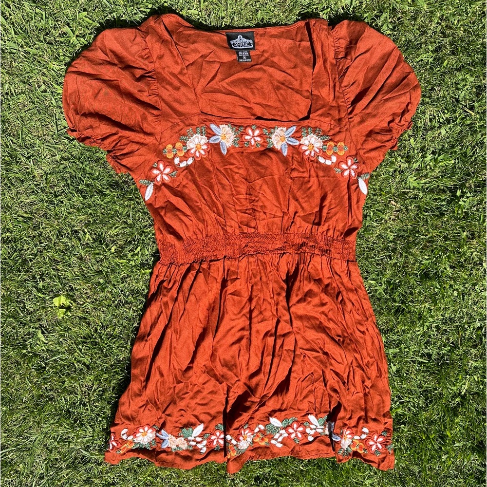 orange dress with embroidered flowers